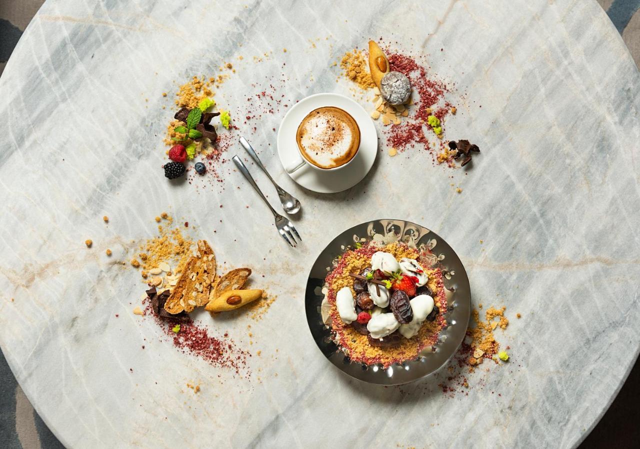 Asiana Grand Hotel Dubai Bagian luar foto A typical breakfast at the restaurant