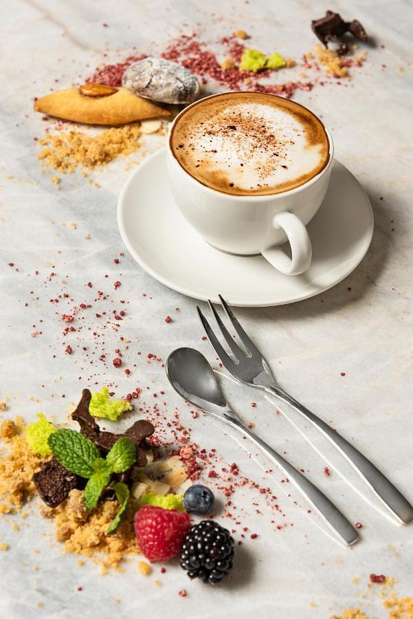 Asiana Grand Hotel Dubai Bagian luar foto A coffee cup with a saucer