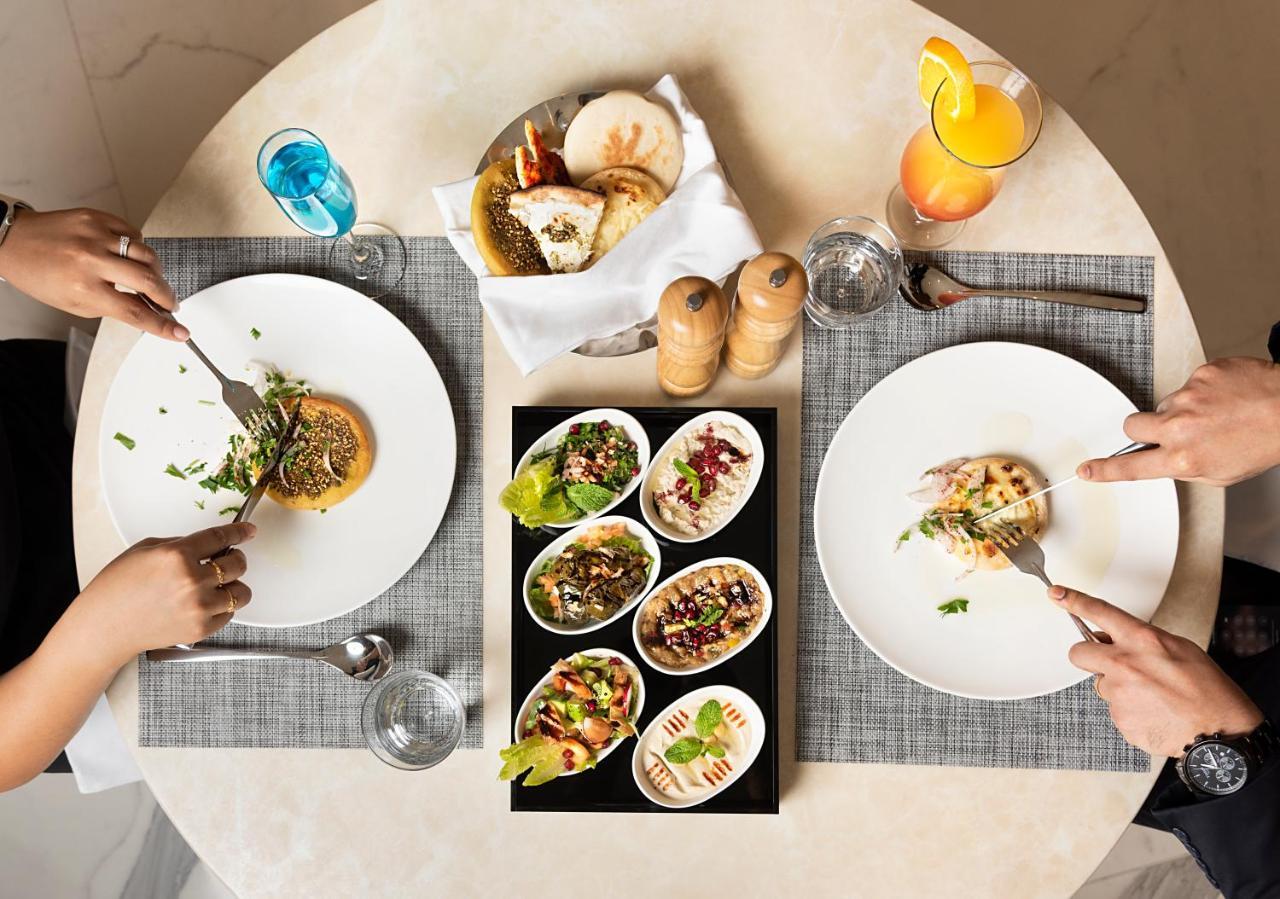 Asiana Grand Hotel Dubai Bagian luar foto A selection of meze