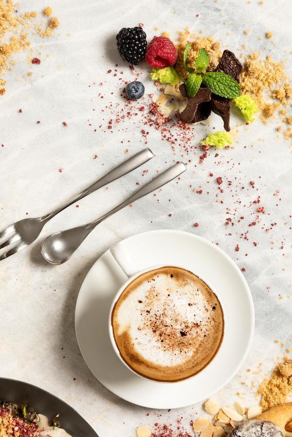 Asiana Grand Hotel Dubai Bagian luar foto A cup of coffee